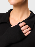 Elegant black polo top from Florence, designed for versatility and comfort, perfect for everyday wear.