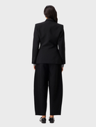 Elegant black Sonder Blazer on a hanger, showcasing a modern cut ideal for professional and formal settings.