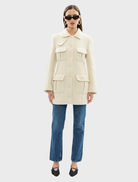 Chic ivory Franca Wool Blazer Dress showcasing a structured fit, suitable for business and upscale events.