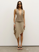 Frankie Skirt in Dune color, featuring a flowing design and lightweight fabric, perfect for casual or dressy occasions.
