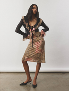 Mesh leopard print frill cardigan, combining elegance and a wild pattern for a fashionable statement piece.

