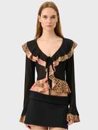 Frill cardigan featuring a mesh design with a leopard print pattern, showcasing a stylish and trendy look.