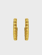 Fashionable gold Gabrielle earrings with a distinctive style, perfect for accessorizing various outfits.