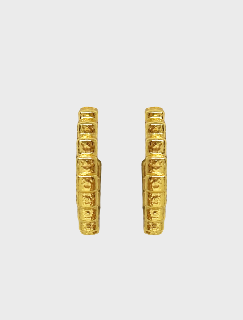 Fashionable gold Gabrielle earrings with a distinctive style, perfect for accessorizing various outfits.