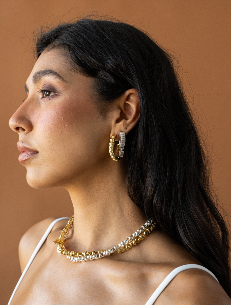 Stylish gold Gabrielle earrings with a contemporary look, ideal for enhancing any outfit.