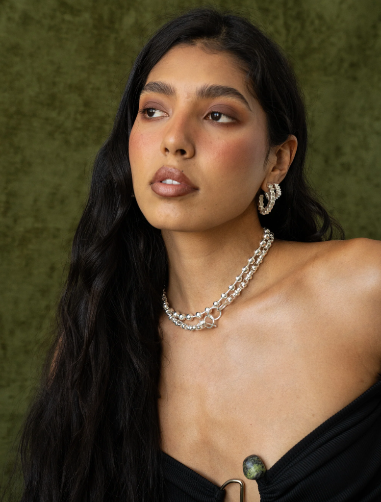 A pair of silver Gabrielle earrings showcasing a stylish and contemporary design.