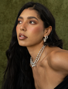 Stylish silver Gabrielle earrings, offering a chic accessory option for diverse fashion ensembles.