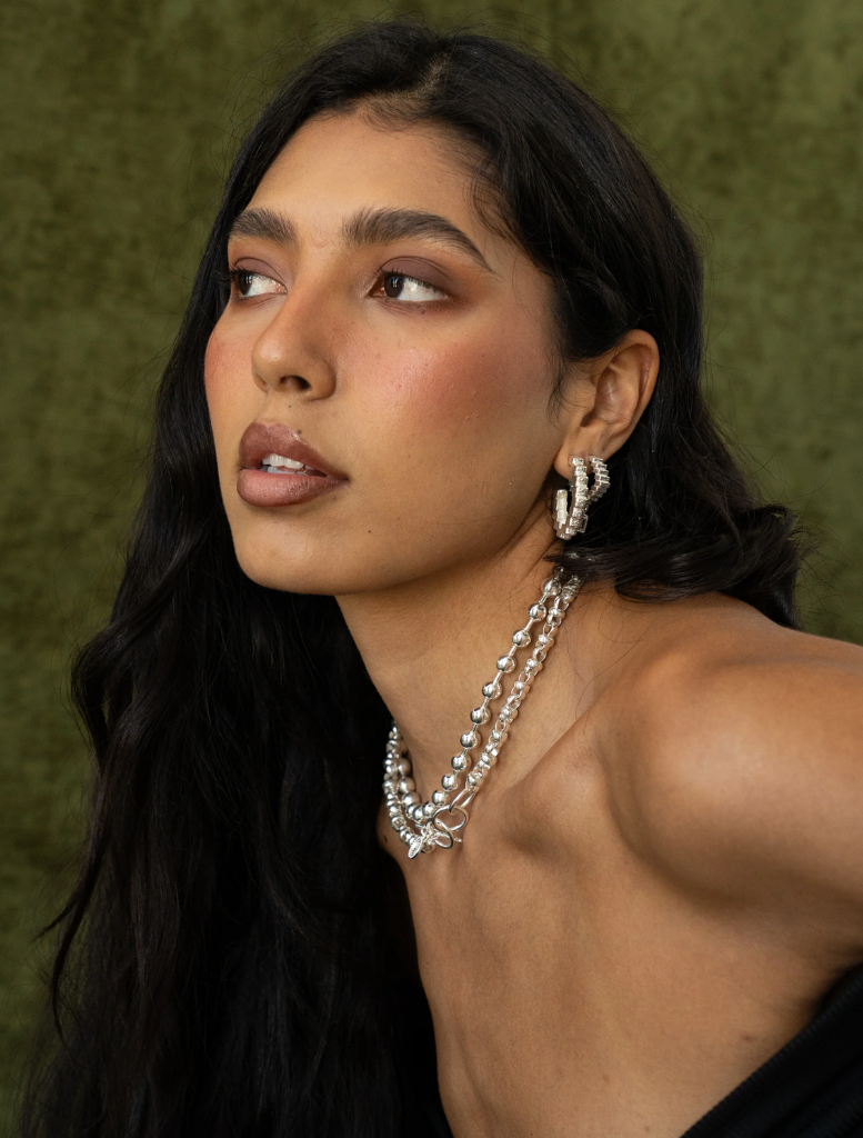 Stylish silver Gabrielle earrings, offering a chic accessory option for diverse fashion ensembles.