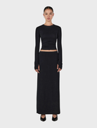Black Gerard wool skirt, featuring a classic design suitable for formal or casual occasions.
