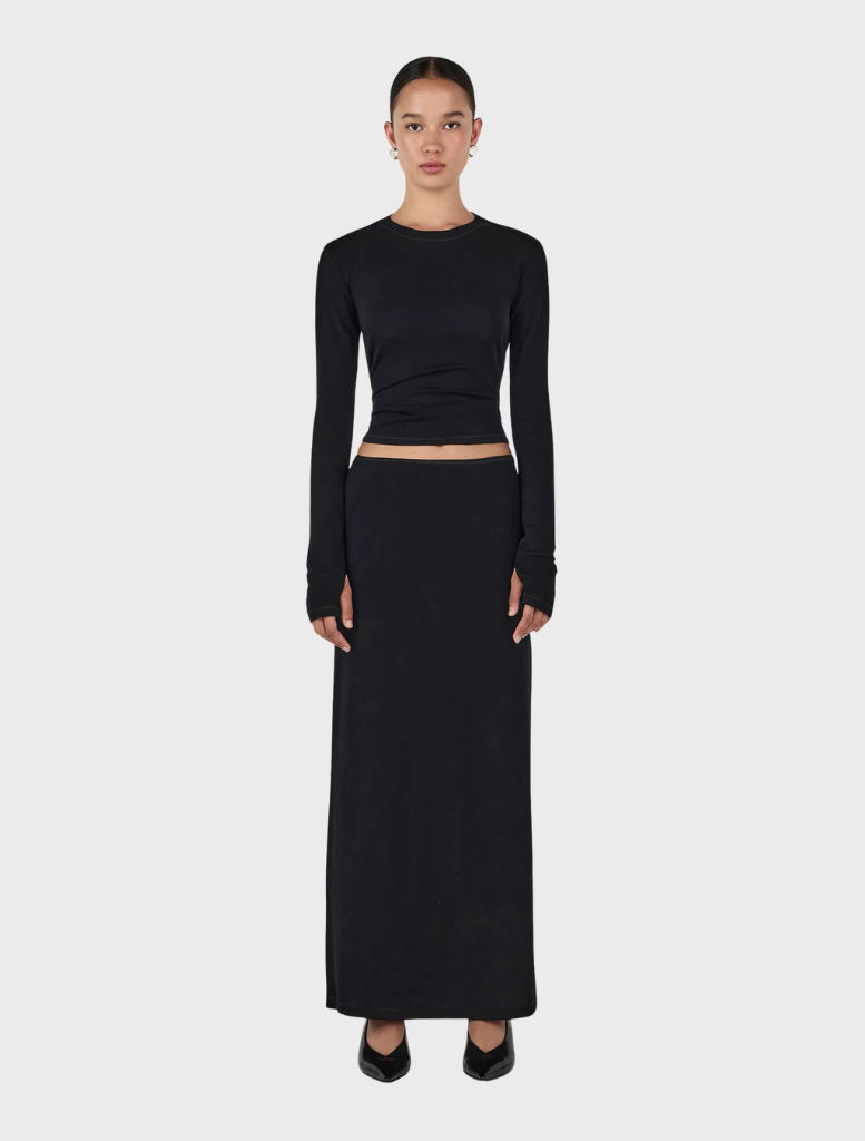 Black Gerard wool skirt, featuring a classic design suitable for formal or casual occasions.

