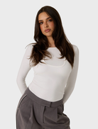 White double layer top featuring a stylish design, suitable for various occasions and easy to pair with different outfits.