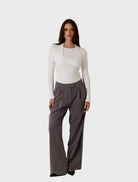 Contemporary white double layer top, designed to enhance any wardrobe with its versatile and elegant look.