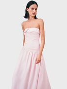 Gigi Strapless Maxi Dress in Sakura print, featuring a flowing silhouette and vibrant floral design.
