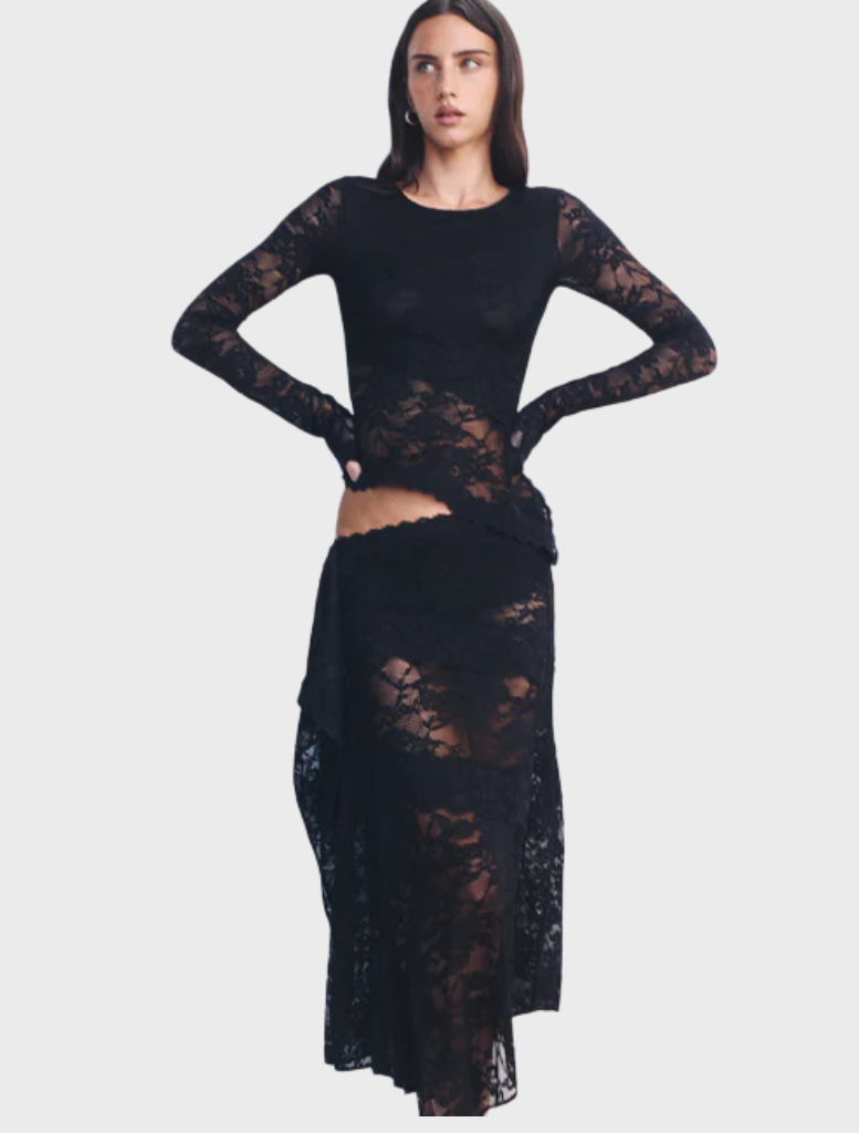 Black Gigi wrap skirt displayed on a mannequin, featuring a flowing design and adjustable tie at the waist.