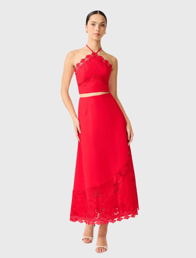 Red Giovanna Set with a halter neckline top adorned with lace and a matching maxi skirt featuring lace detailing at the hem.