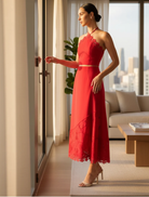 Elegant red Giovanna Set includes a halter neck top with lace accents and a coordinating maxi skirt with lace trim.