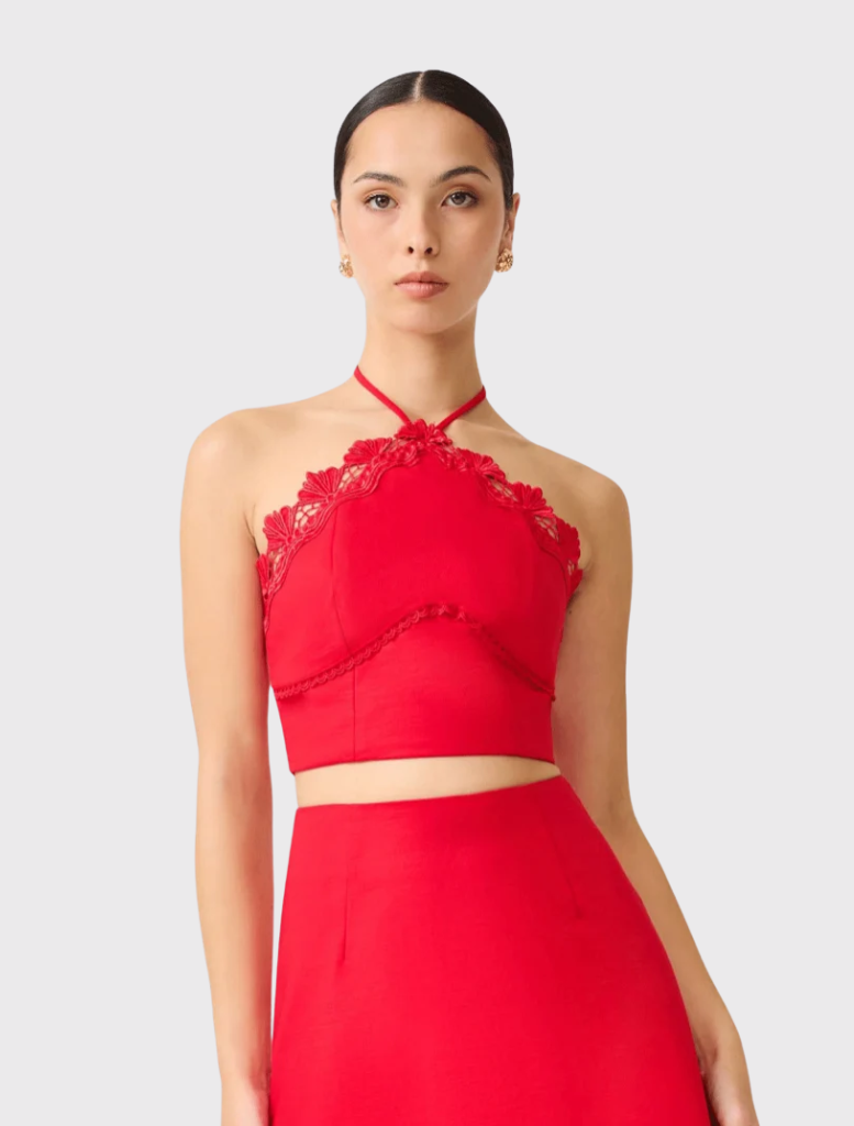 Two-piece red Giovanna Set featuring a halter top with lace trim and a matching maxi skirt with lace hem detailing.