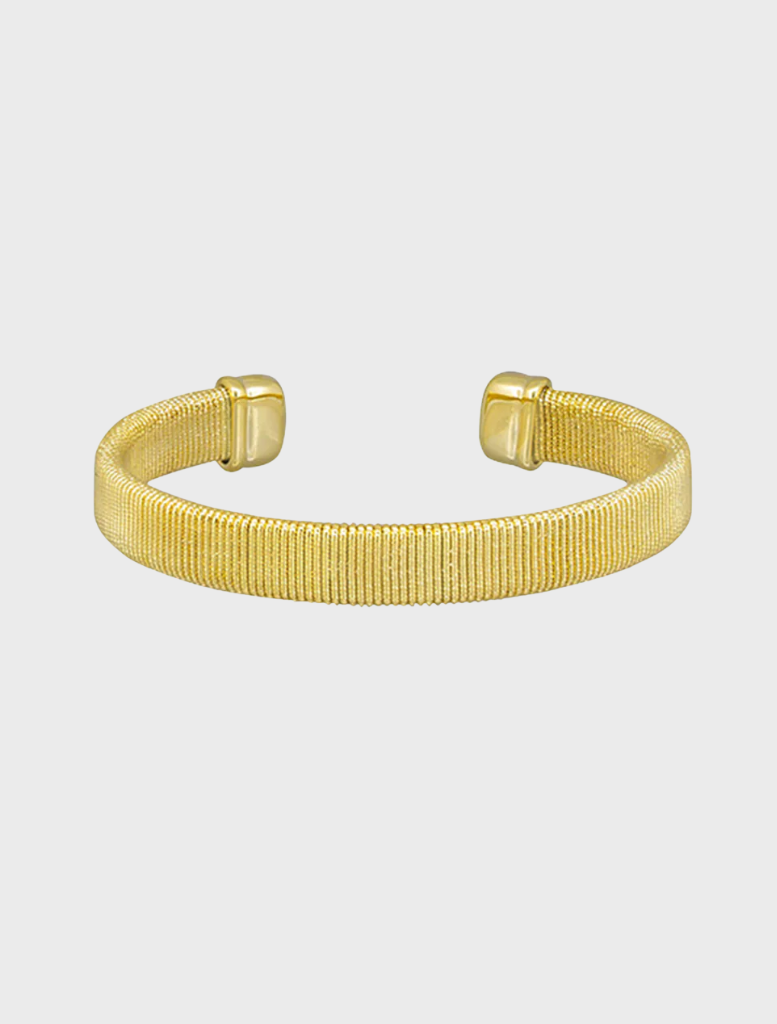 A gold cuff bracelet featuring a sleek, modern design, showcasing a polished finish and elegant curves.