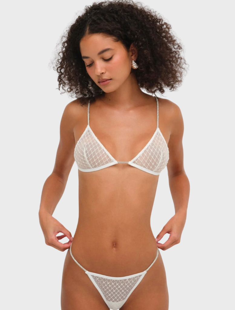 White glitter bralette with a shimmering finish, designed for a stylish and eye-catching look.