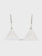White bralette embellished with glitter, offering a chic and radiant fashion statement.