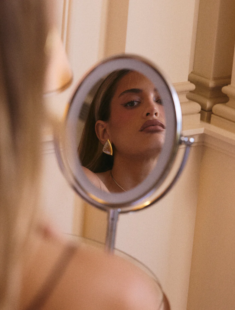 Bianco Nero Studs - Gold: two-tone triangle stud earrings in gold and silver, perfect for adding a chic touch to any outfit.