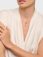 Elegant gold ring inspired by Cher, highlighting a distinctive and stylish design for fashion enthusiasts.
