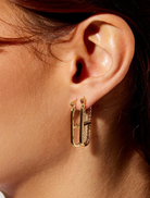 Gold OG Earrings featuring clear crystals, inspired by the LOVE DRUG PILL necklace, with profits supporting GIRLS Inc.