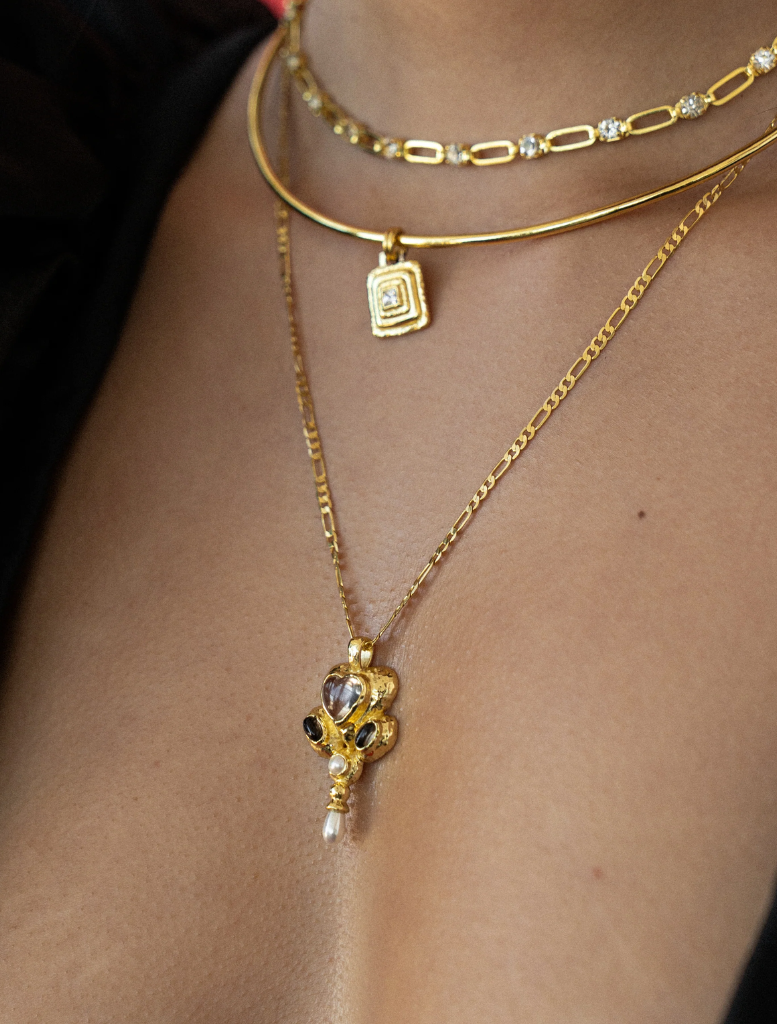Stunning gold Priya necklace showcasing a unique design, suitable for special events.