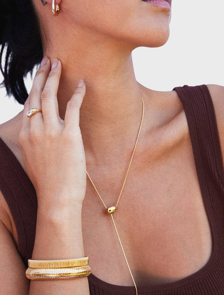 Close-up of a gold Yunna necklace, showcasing its delicate craftsmanship and stylish appearance.