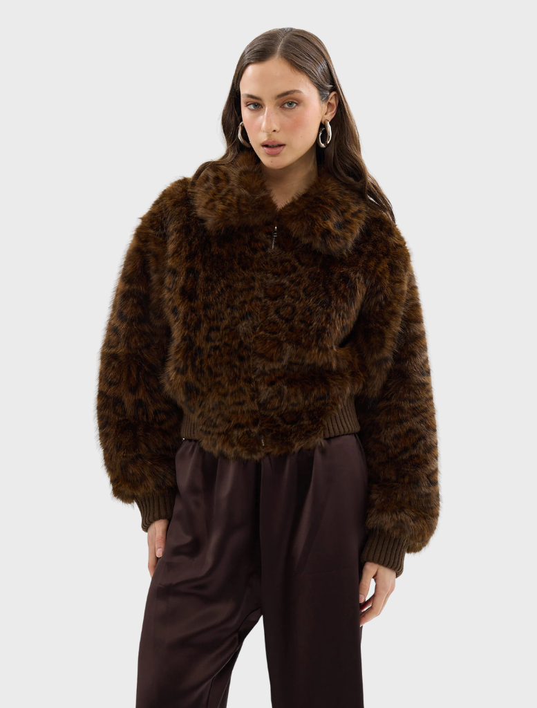 Chocolate leopard faux fur bomber jacket on a mannequin, illustrating its chic style and contemporary appeal.