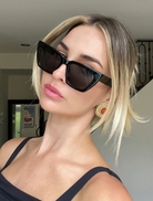 Hailey II sunglasses with a modern black frame and grey lenses, ideal for a chic look on sunny days.