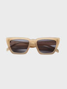 Hailey II sunglasses featuring a nude frame and grey lenses, stylish and modern for any occasion.