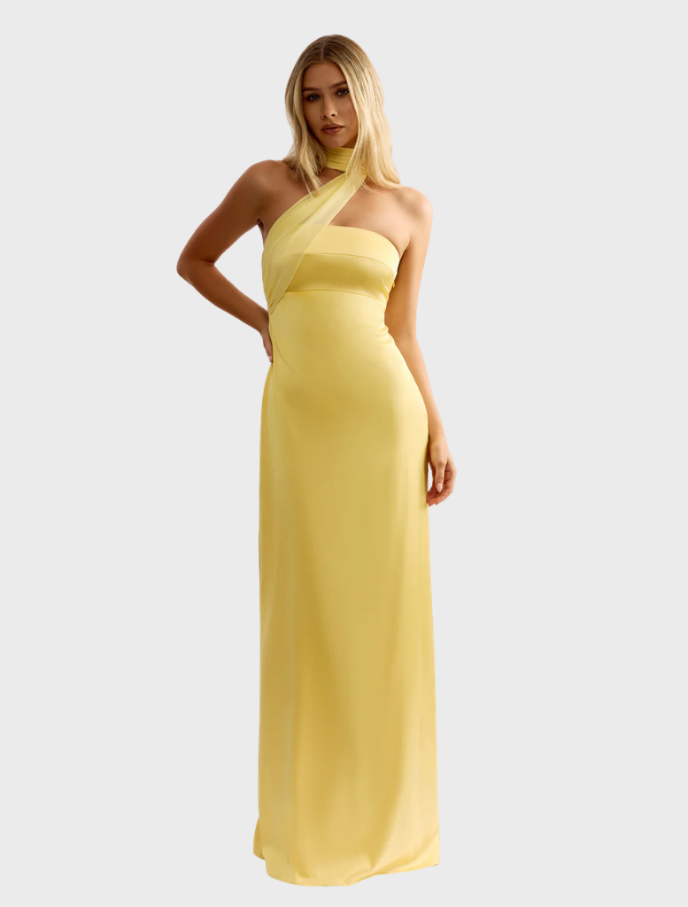 Hali Dress in sunflower yellow, featuring a flowing design and floral pattern, perfect for summer occasions.