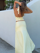 Lemon and chocolate polka dot Melody Halter Cowl Top, highlighting a chic and contemporary fashion choice.