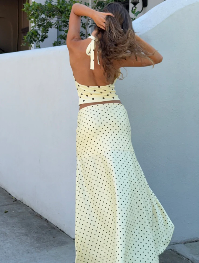 Lemon and chocolate polka dot Melody Halter Cowl Top, highlighting a chic and contemporary fashion choice.