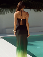 Stylish black halter top with a split front, offering a contemporary flair for various fashion ensembles.