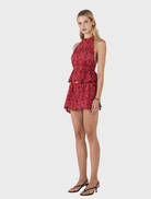 Celeste halter top made of cherry Anglaise, designed with a feminine cut and elegant floral embroidery.