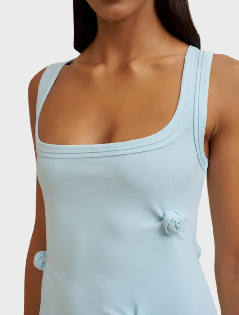 Ice blue midi dress crafted from stretch crepe, adorned with tucks and a 3D rosette, with a discreet back zipper.