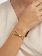 Elegant gold bracelet named Ida, showcasing a refined and stylish design suitable for various occasions.