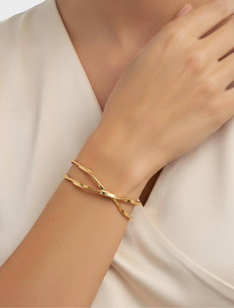 Elegant gold bracelet named Ida, showcasing a refined and stylish design suitable for various occasions.
