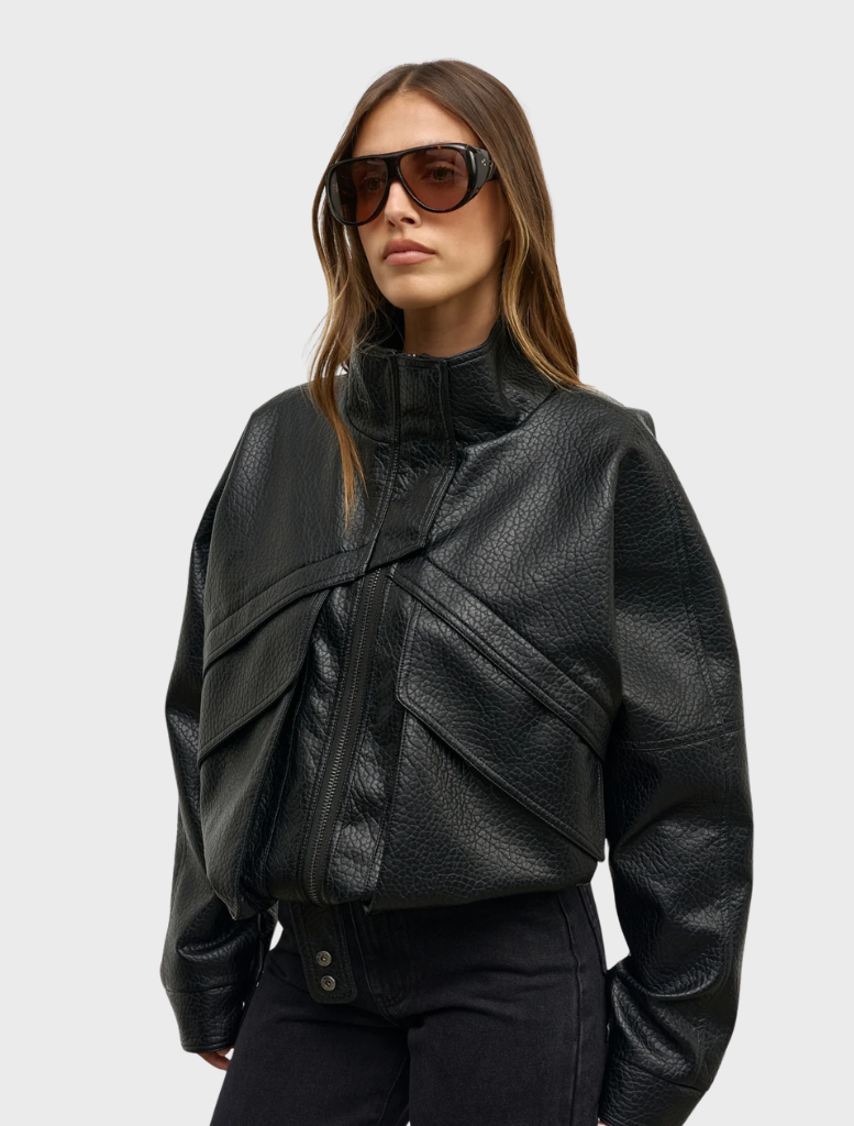 Elegant black Inez Jacket hanging, highlighting its contemporary style and versatility for different fashion ensembles.