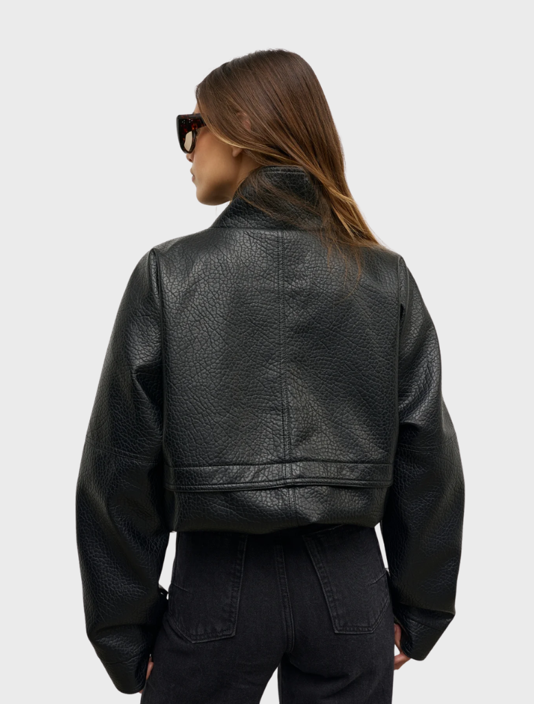 The Inez Jacket in black, showcasing a tailored fit and contemporary style, perfect for both casual and formal wear.
