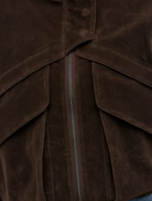 Elegant deep brown Inez jacket hanging, highlighting its contemporary style and versatile appeal for different outfits.
