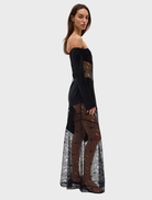 Stylish off-shoulder dress in deep ink hue, showcasing a tailored bodice and a soft, flowing silhouette.