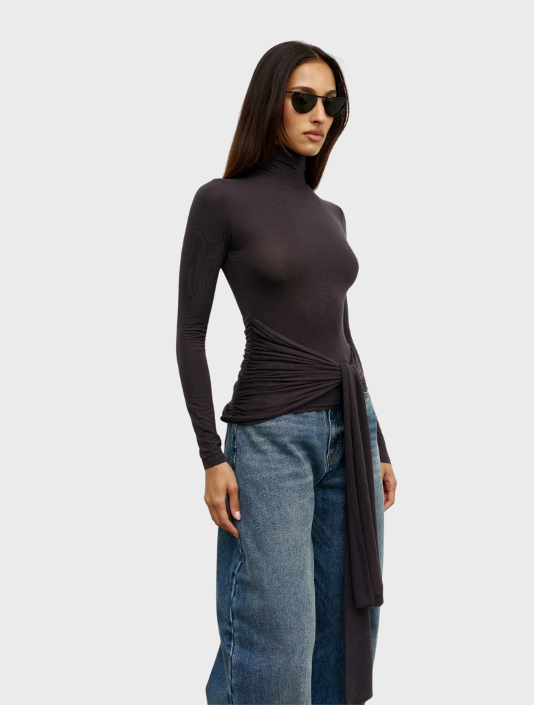 Charcoal Isley Top featured on a hanger, emphasizing its elegant cut and color.