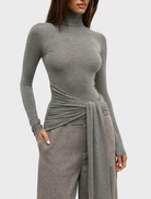 Isley top in light grey marle, presented on a hanger, highlighting its comfortable and versatile design.