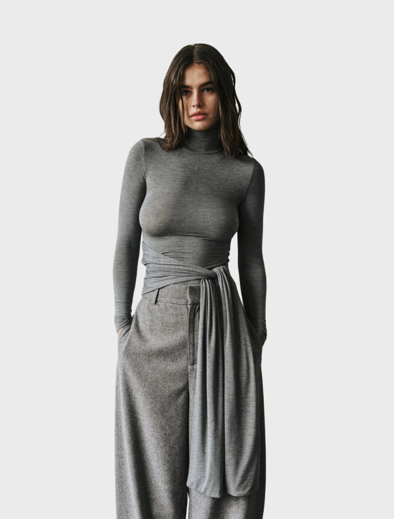Light grey marle Isley top displayed on a hanger, showcasing its soft fabric and casual design.