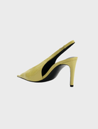 Yellow patent slingback pumps with a glossy finish and a stylish crinkle texture, ideal for fashionable outfits.