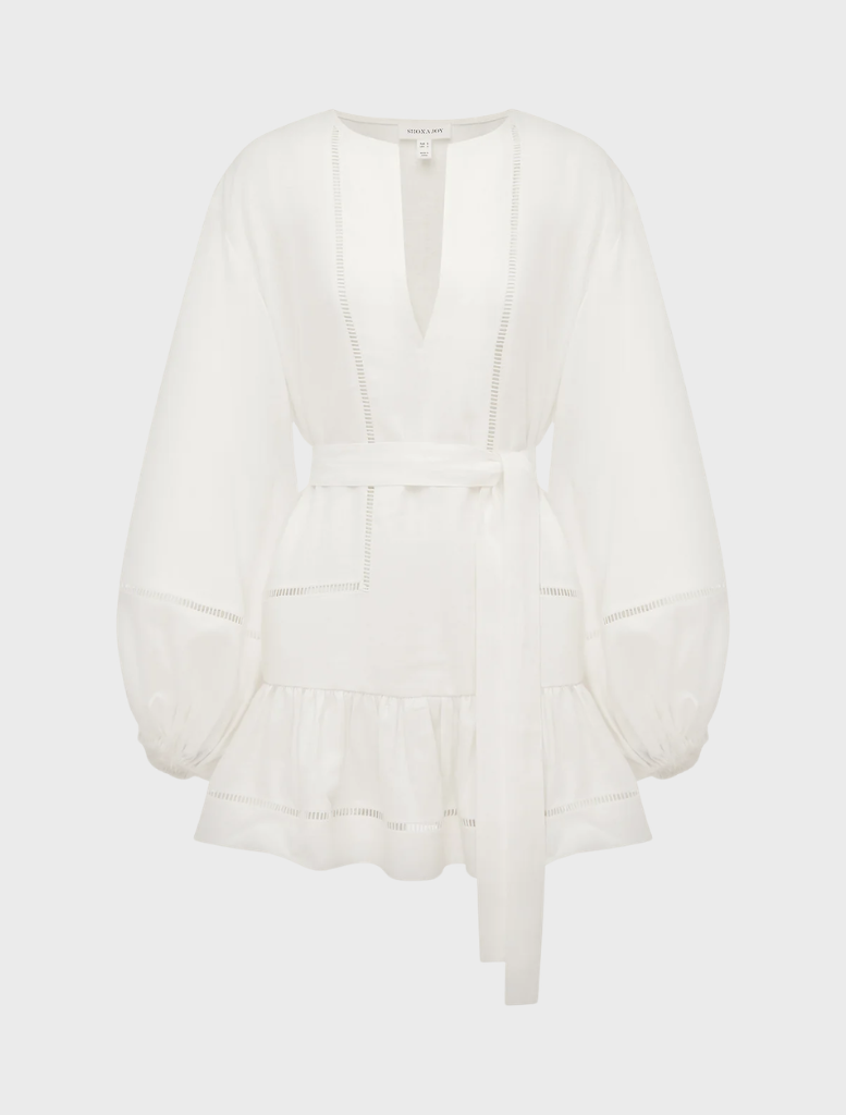 Ivory mini dress with voluminous balloon sleeves and a playful design, suitable for various social events.