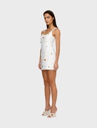 Elegant ivory Romy Mini Dress with a flattering cut, ideal for summer outings or special events.